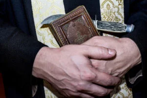 Priest-holding-Bible
